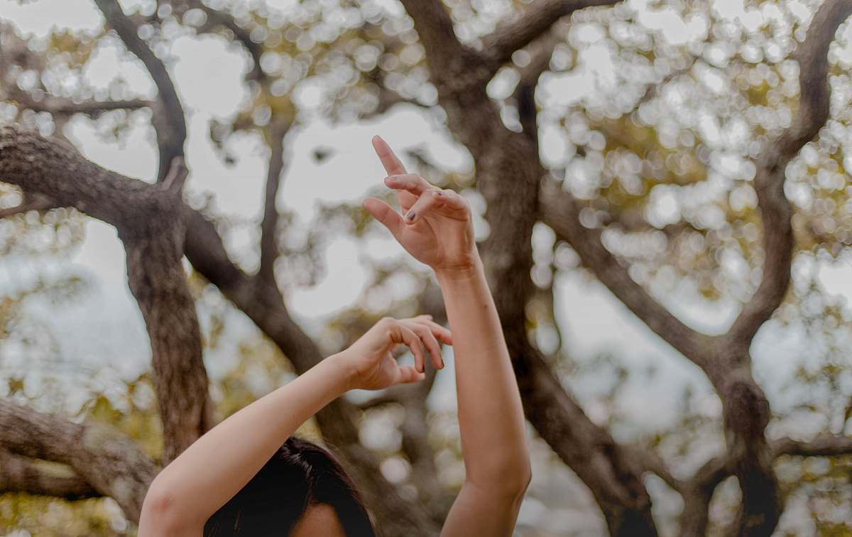 state of mexico woman raising hands near tree mexico